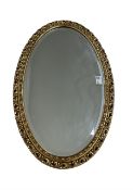 Gilt framed oval wall mirror