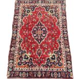Vintage Persian red ground rug