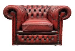 Red chesterfield armchair