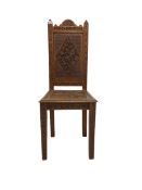 Oak hall chair with carved panelled seat and back on square tapering supports
