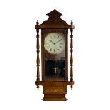A 19th century American wall clock manufactured by the �New Haven� clock company