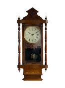 A 19th century American wall clock manufactured by the �New Haven� clock company