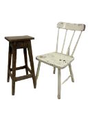 White spindle back chair together with pine stool