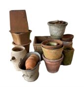 A large collection of garden planters of different styles and sizes