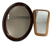 Early 20th century bevel edge oval wall mirror in moulded frame 63cm x 87cm and a G Plan style mirro