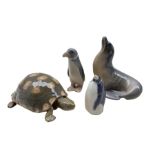 Four Royal Copenhagen porcelain animals comprising a Sea Lion no. 1441 and Penguin looking up no. 30