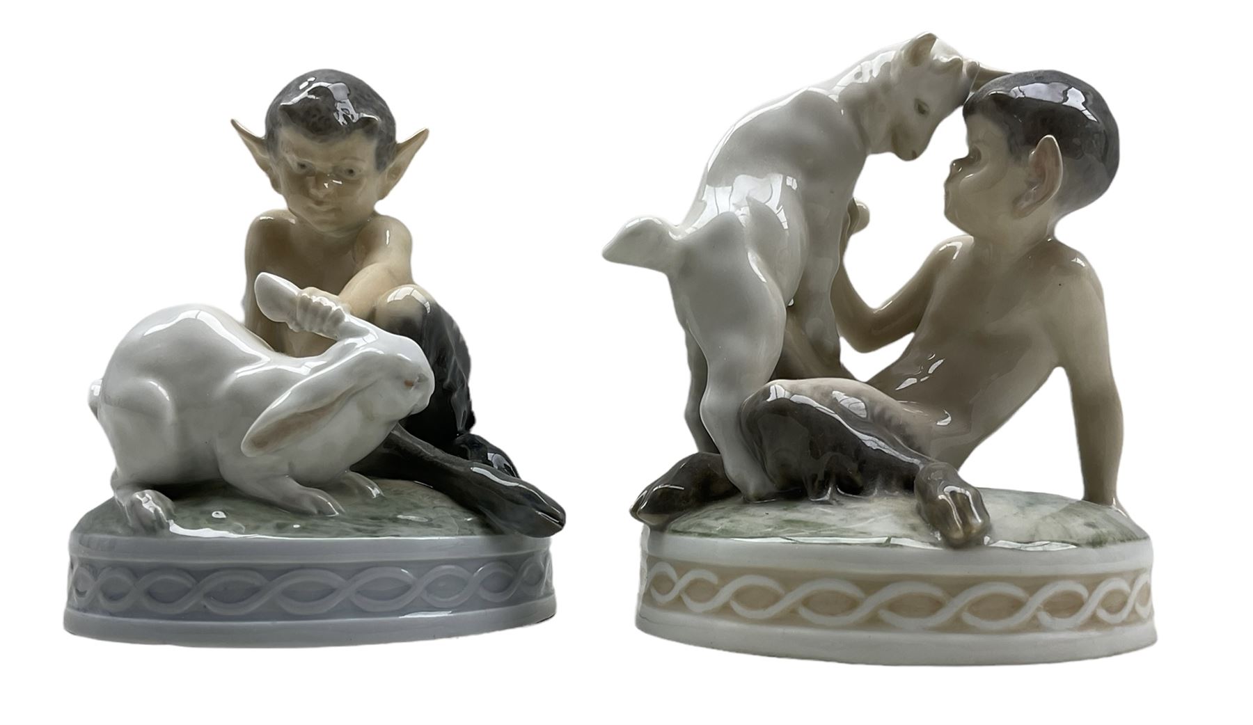 Two Royal Copenhagen figures 'Faun with Goat' no. 498 and 'Faun with Rabbit' no. 439