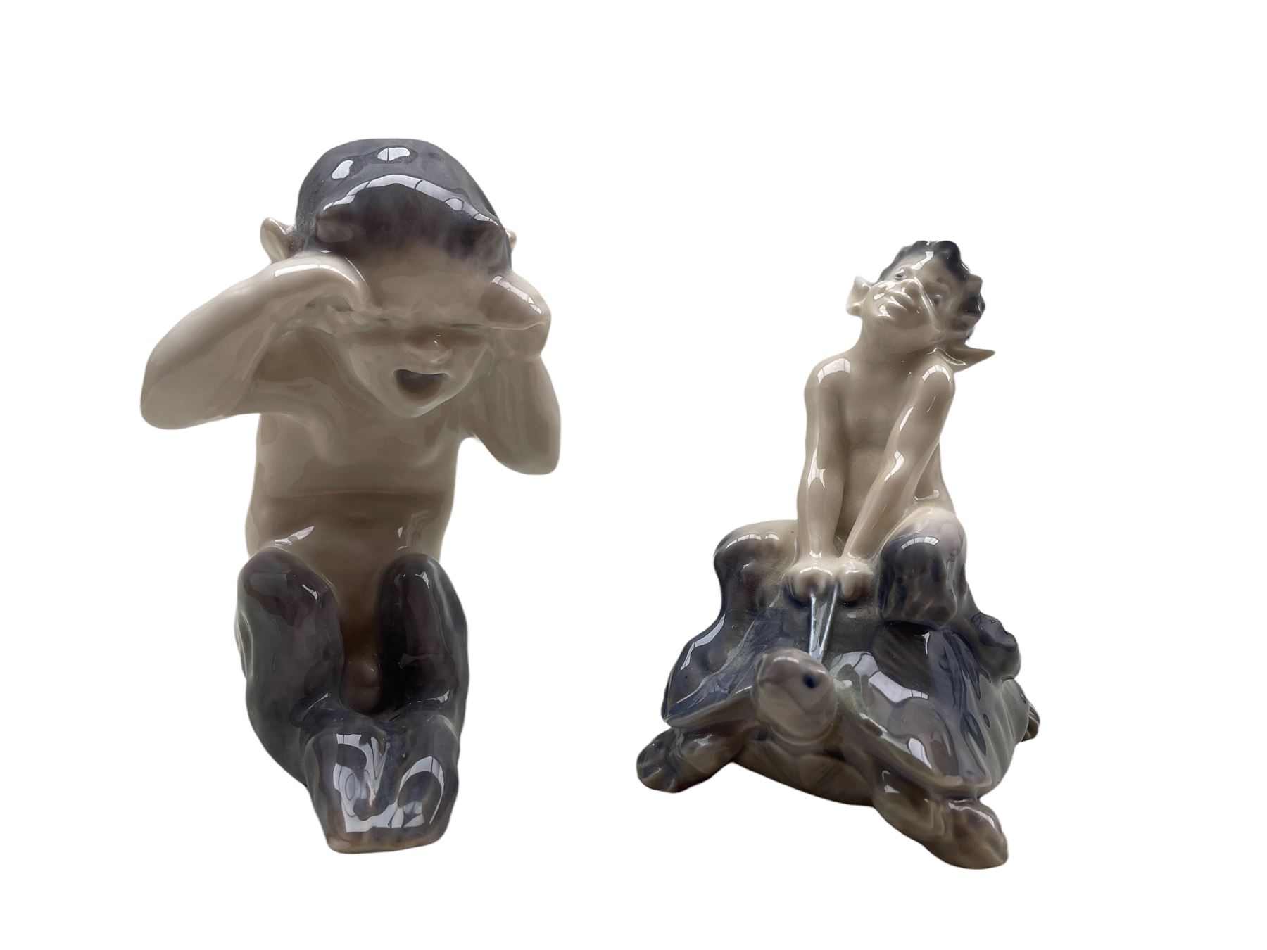 Two Royal Copenhagen figures 'Crying Faun' no. 1061 designed by Knud Kyhn H11cm and 'Faun on Tortois