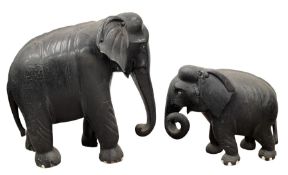Large Indian carved and ebonised wood elephant H66cm x L64cm and a smaller similar elephant H38cm x