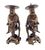 Pair of Chinese carved hardwood standing figures each holding prayer beads and on pierced bases H36c