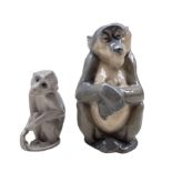 Royal Copenhagen porcelain figure of a Monkey no. 1444 designed by Niels Nielsen together with a Bin