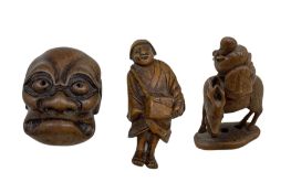 19th century Japanese boxwood netsuke in the form of a man playing the flute and riding on a deer