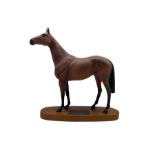 Beswick model of Red Rum from the Connoisseur series on wooden plinth
