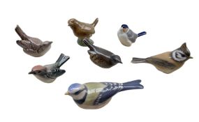 Four Royal Copenhagen porcelain birds comprising a Bluetit no. 1505