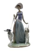 Large Lladro figure 'Elegant Promenade' modelled as a lady walking a Borzoi and Afghan Hound