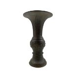 19th century Chinese bronze Gu shape vase with raised pattern of script etc H26cm