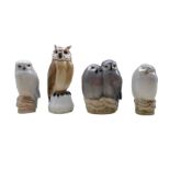 Three Royal Copenhagen porcelain Owls comprising a pair of Owls no. 834 designed by Theodor Madsen
