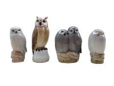 Three Royal Copenhagen porcelain Owls comprising a pair of Owls no. 834 designed by Theodor Madsen