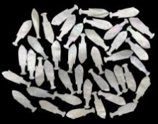 Forty-three 19th century Chinese mother-of-pearl fish form gaming tokens (43)