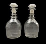 Pair of Regency glass triple ring neck decanters with fluted decoration and compressed mushroom stop