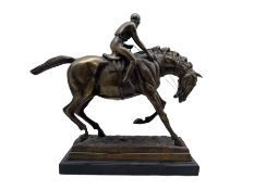 Bronze model of a racehorse with jockey up on marble base H34cm x L38cm