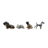 Four Royal Copenhagen porcelain dogs comprising a Boxer Puppy no. 3169