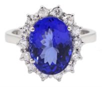 18ct white gold oval tanzanite and round brilliant cut diamond cluster ring