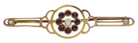 Early 20th century 9ct rose gold garnet and split pearl bar brooch