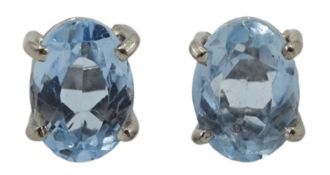 Pair of 18ct white gold single stone oval aquamarine stud earrings