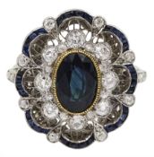 Platinum oval cut sapphire and old cut diamond cluster ring
