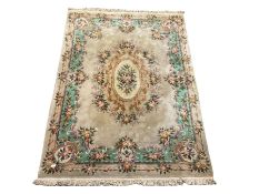 Chinese washed wool beige rug with all over foliate and floral design 272cm x 390cm