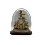 A French gilt spelter striking mantle clock housed under a glass dome c 1880