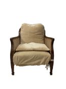 20th century cane back chair with beige cushions