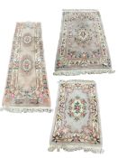 Three Chinese washed woollen rugs