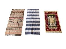 Three flat weave rugs of various different styles and sizes
