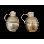 Pair of white metal salt and pepper pots in the form of Guernsey milk jugs