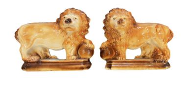 Pair of Staffordshire type lions