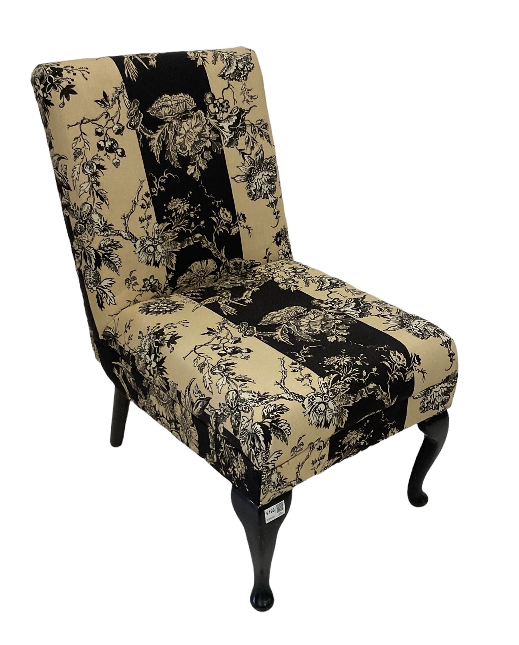 Chair upholstered in black and cream fabric