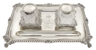 Edwardian silver inkstand of rectangular form with shell moulded and gadrooned edge fitted with two