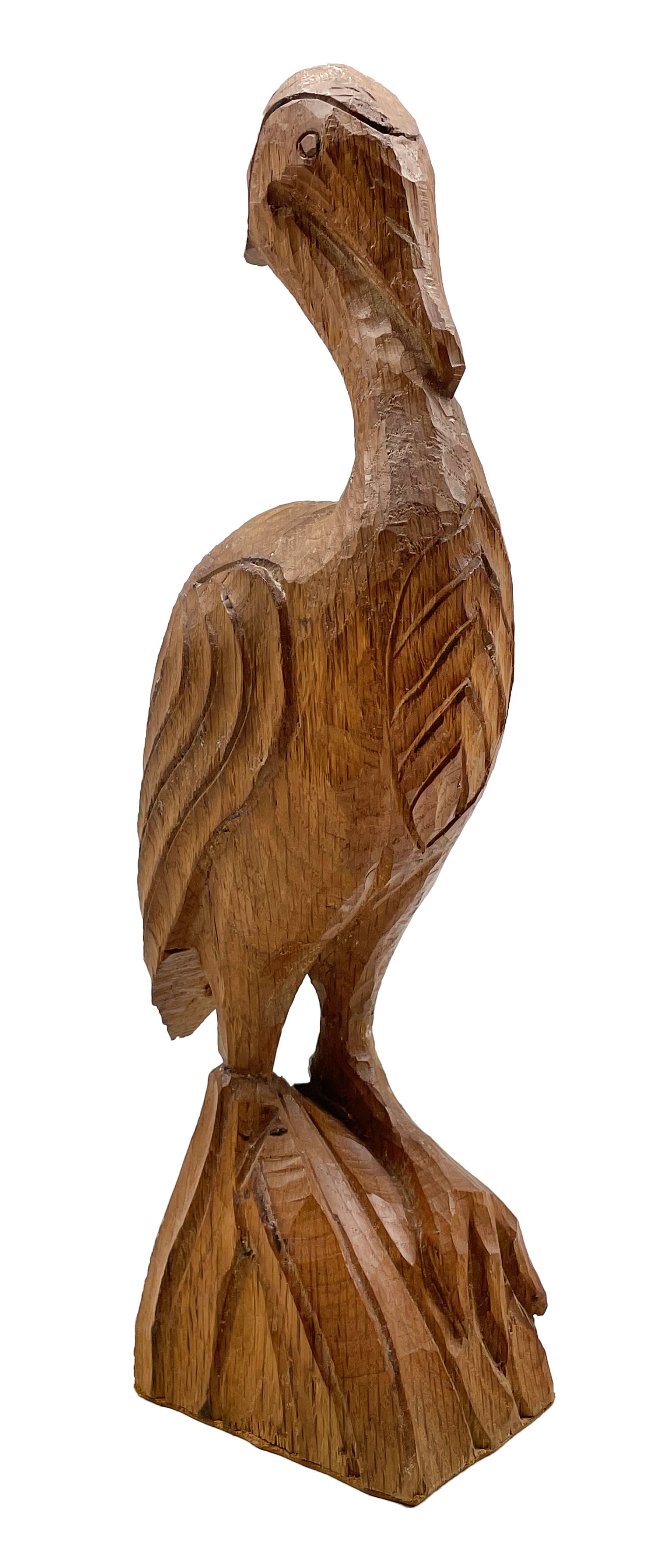 'Gnomeman' carved oak figure of a wading bird