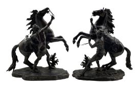 After Guillaume Coustou (1677-1746): Pair of bronze Marly horses with their groom