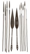 Nine African Zulu spears and a pair of wooden paddle clubs with hatch carved decoration L151cm (11)