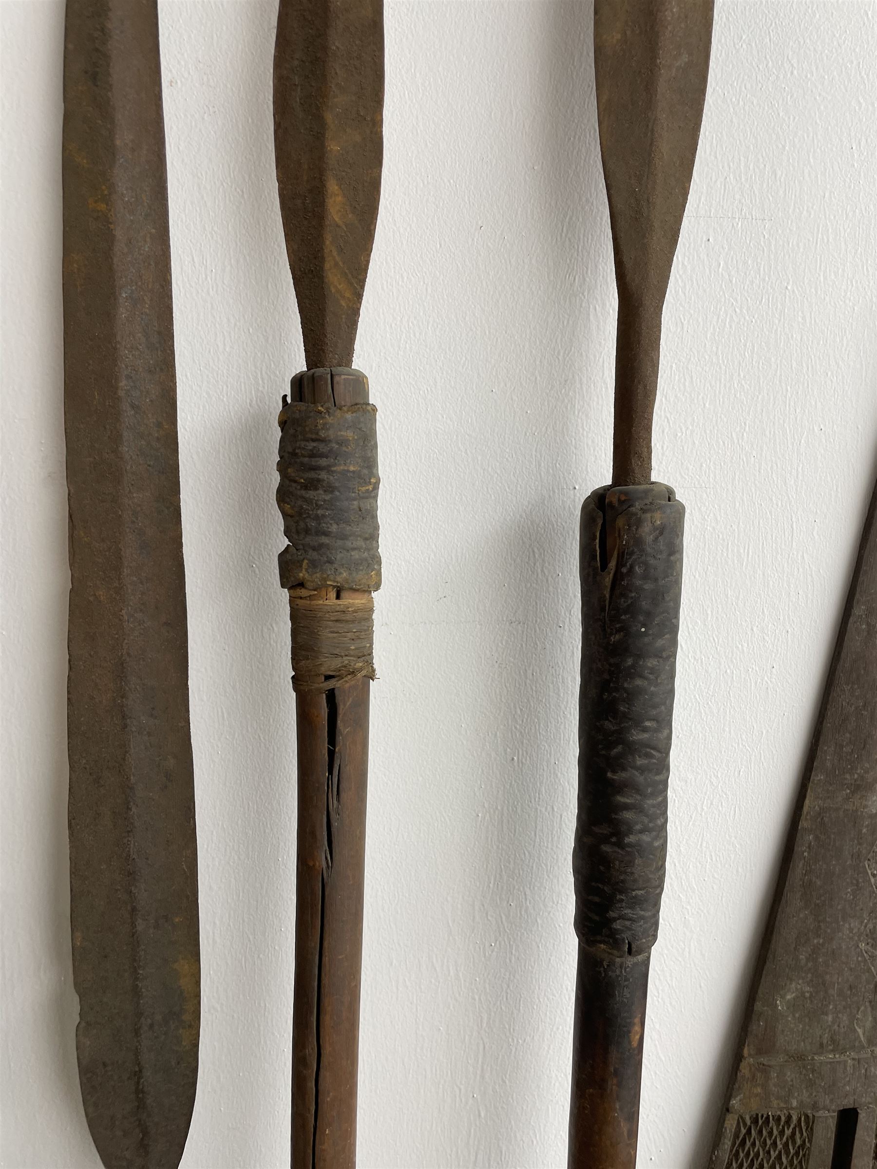 Nine African Zulu spears and a pair of wooden paddle clubs with hatch carved decoration L151cm (11) - Image 5 of 8