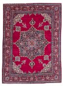 Large Persian Meshed red ground carpet