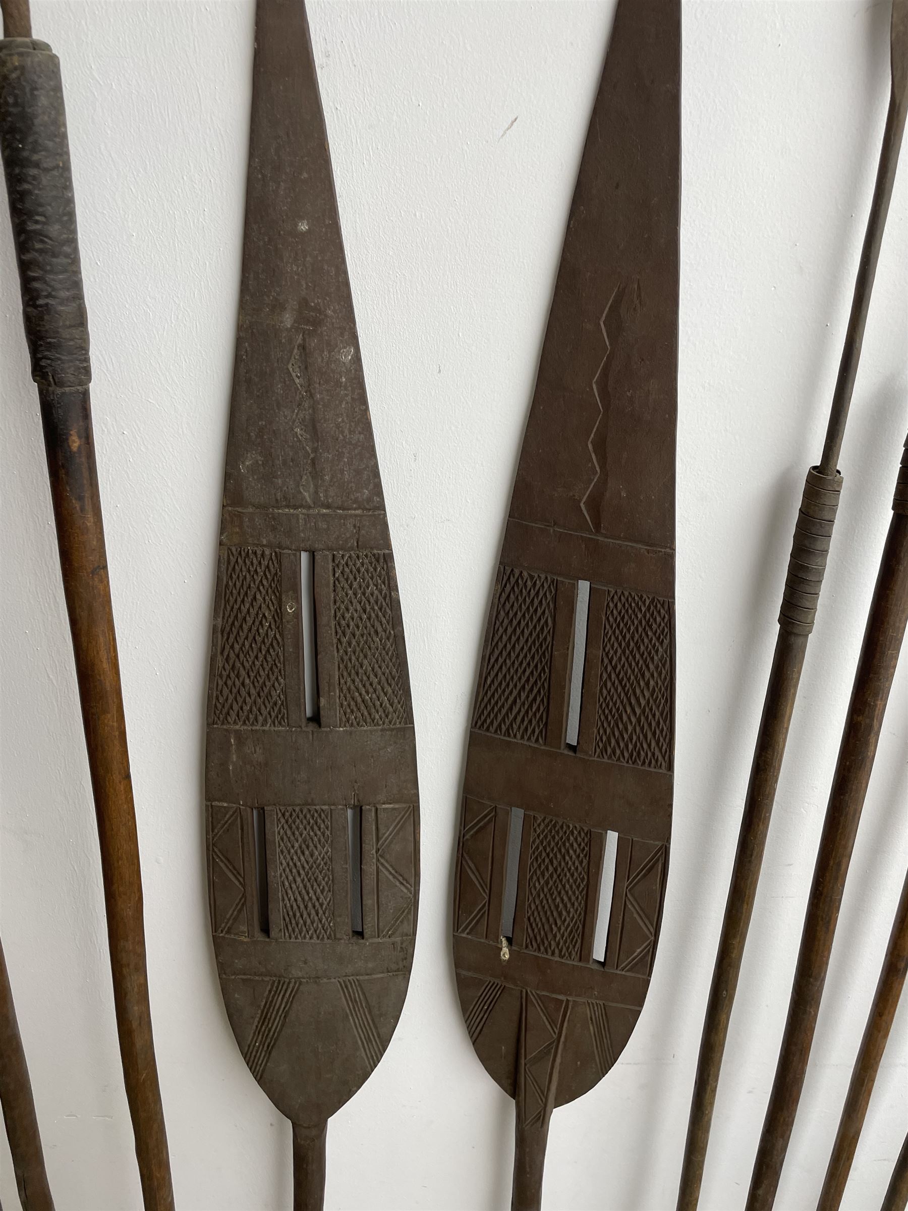 Nine African Zulu spears and a pair of wooden paddle clubs with hatch carved decoration L151cm (11) - Image 4 of 8