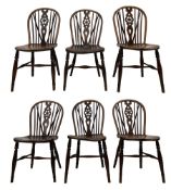 Early 19th century harlequin set of six elm and beech Windsor chairs