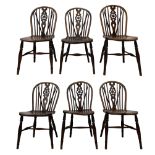 Early 19th century harlequin set of six elm and beech Windsor chairs