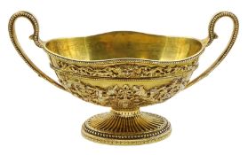 George III silver gilt sauce boat of oval design with two bead edge handles and with later applied c