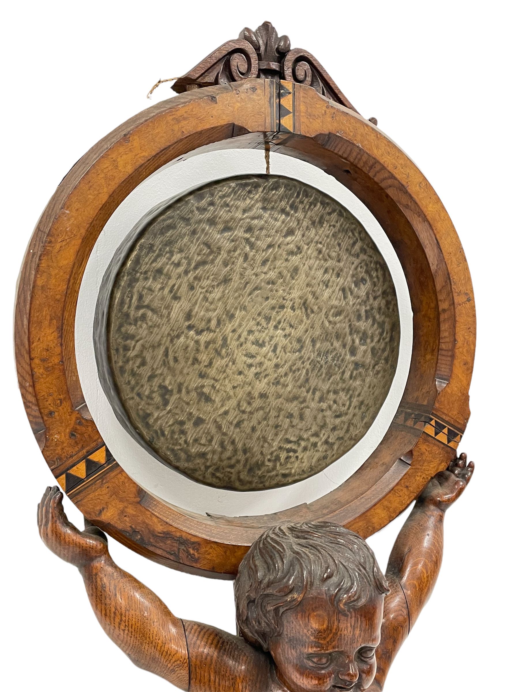 Victorian carved oak gong stand in the form of a Cherub supporting a circular walnut frame with cent - Image 3 of 5