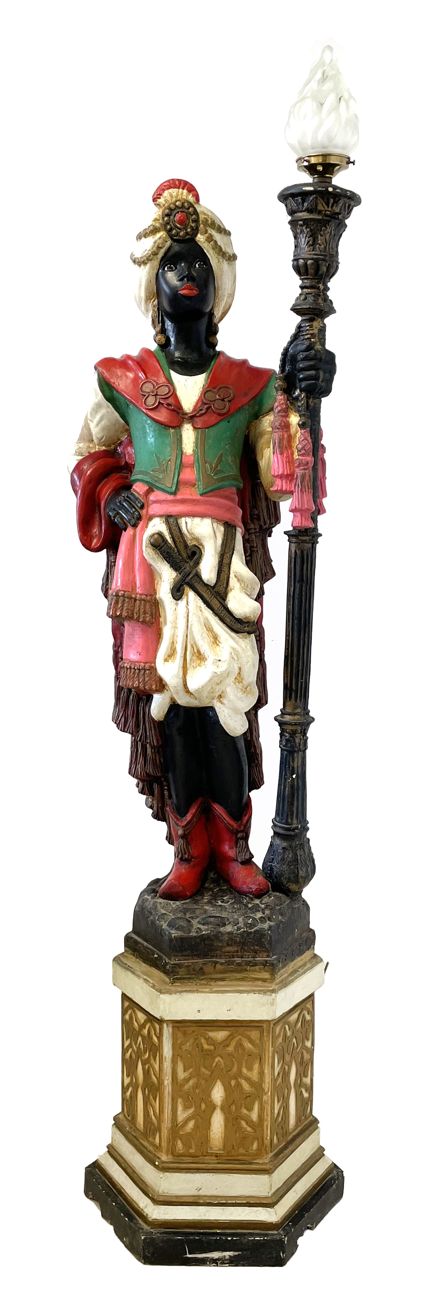 Standard lamp in the form of a Moorish courtier holding a light in the form of a torch staff